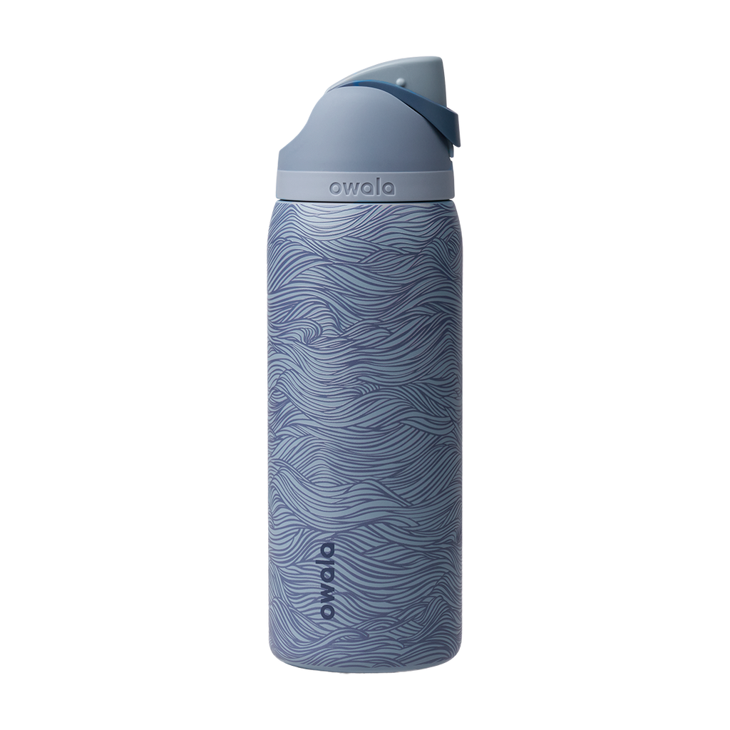 Owala FreeSip 32oz, slate blue body with embossed wave texture, lighter blue-gray lid, slate flip cap, and darker blue carry loop